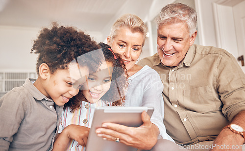 Image of Happy, children and grandparents with a tablet in a house, streaming cartoon or a movie online. App, smile and interracial kids and senior man and woman with technology for a film, game or website