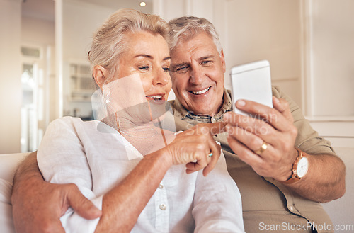 Image of Home, smile and senior couple with a smartphone, love and quality time with social media, chatting and sms. Cellphone, old man and elderly woman with happiness, mobile app and relax with connection