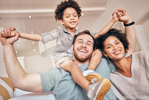 Image of Mom, dad and boy on shoulders, piggyback and portrait in home with smile, holding hands and solidarity. Interracial family house, mother and father with son, playing plane games and bonding with love