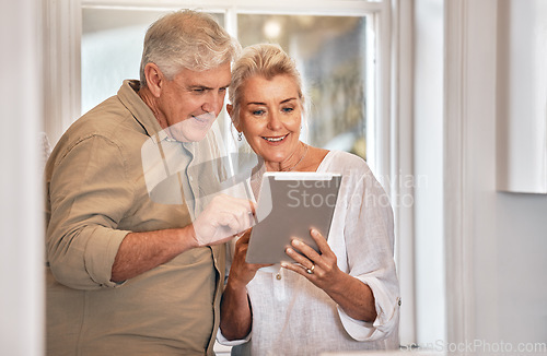 Image of Home, typing and senior couple with a tablet, love and website information with social media, chatting and sms. Technology, old man and elderly woman with happiness, search internet and connection