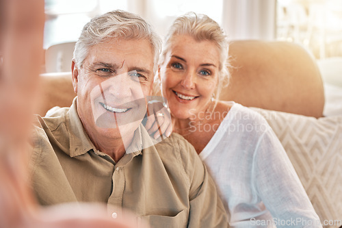 Image of Happy senior couple, face and selfie in relax on living room sofa for photograph, memory or vlog at home. Elderly man and woman smile for picture, photo or social media post on lounge couch together