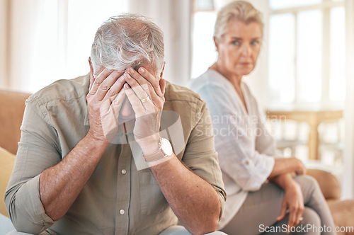 Image of Senior couple, divorce and conflict in fight, argument or disagreement on living room sofa at home. Elderly woman and frustrated man in depression, cheating affair or toxic relationship in the house