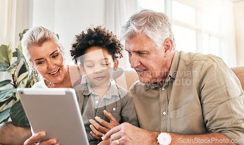 Image of Family, grandparents and child on tablet in home e learning, online education and watch or streaming cartoon. Happy interracial kid and senior people on digital technology for teaching school on sofa