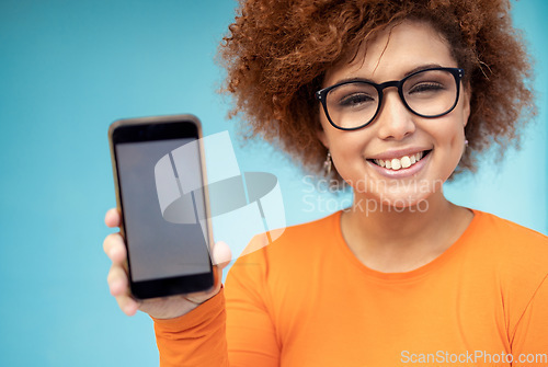 Image of Phone screen, mockup and black woman isolated on blue background mobile app, social media or product placement. Portrait student, person or youth show smartphone for website or tech mock up in studio