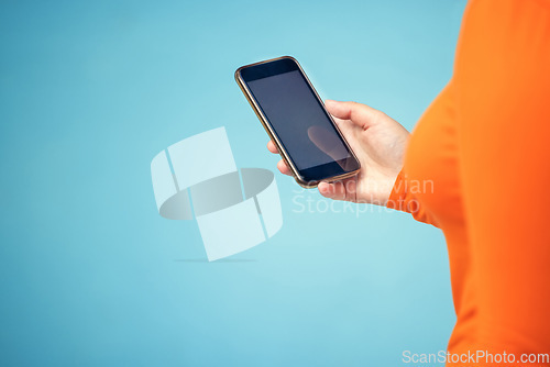 Image of Hand, mockup screen and woman phone for advertising sale, promotion or brand website on internet. Person with smartphone on blue background studio for about us, communication or network connection