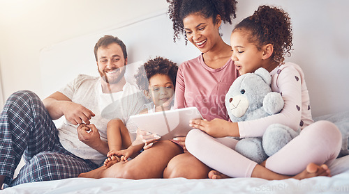 Image of Happy family, bed and tablet streaming, movies or games while bonding, relax and play in their home. Online, subscription and children with parents in a bedroom for entertainment, fun and watching