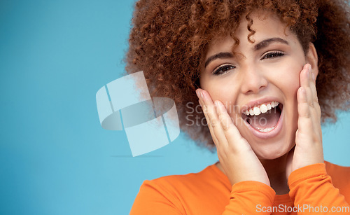 Image of Surprise, happy and portrait of a woman in a studio with mockup space for sale, deal or discount. Happiness, scream and female model with a excited and shocked facial expression by a blue background.