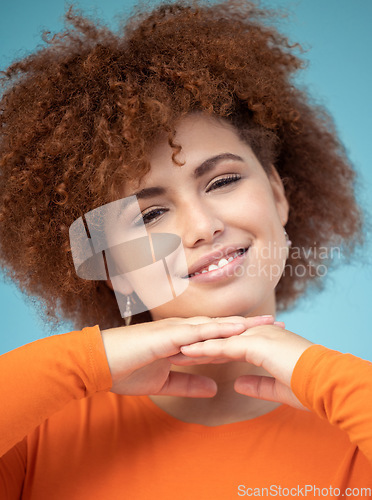 Image of Beauty, smile and portrait of woman on blue background enjoying calm weekend, freedom and relaxing. Fashion, trendy style and face zoom of happy girl with confidence, positive attitude and cosmetics