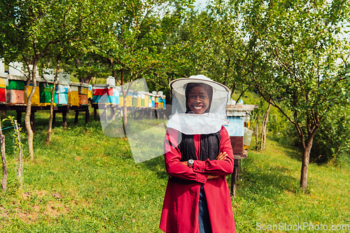 Image of Portrait of an Arab investor located on a large honey farm. Investing in small businesses