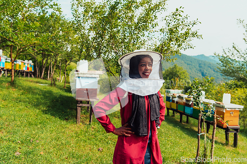 Image of Portrait of an Arab investor located on a large honey farm. Investing in small businesses