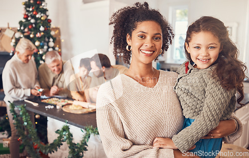 Image of Christmas, portrait and mother with girl, happy together and bonding in home. Xmas, smile and face of kid with African mom, interracial and adoption at family party, celebration and winter holiday