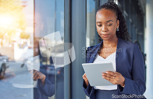 Image of Business, black woman with internet and tablet at window in office, thinking and ideas in research. Email, digital work and insight, businesswoman and online review planning with feedback for project