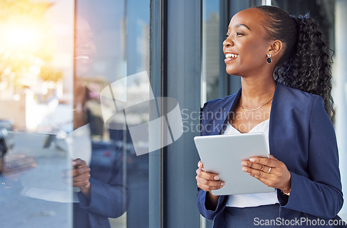 Image of Happy woman, thinking and tablet at window in office, smile and ideas for future in online career. Happiness, digital work and businesswoman with email review, planning and feedback for internet job.