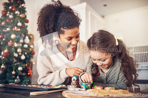 Image of Baker, kid and mother on christmas with smile or teaching to make food in kitchen for celebration. Happy child, parent and education with cookies in home for festive season with learning for cooking.