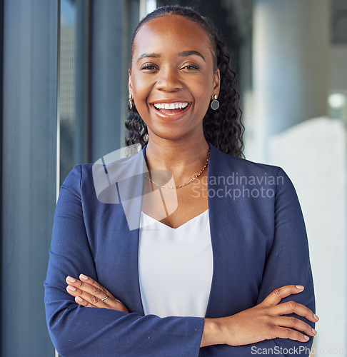 Image of Portrait, smile and arms crossed with a business black woman standing in her professional office. Corporate, leadership and confidence with a happy female manager in the workplace for empowerment