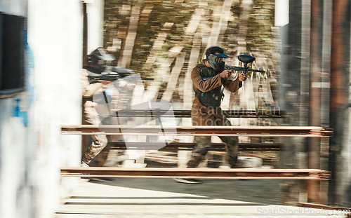 Image of Paintball, battlefield and team, motion blur and attack with target, soldier with gun and fight. Power, war and action, challenge and war games, military tactics and army teamwork with people outdoor