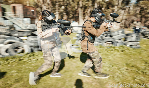 Image of Teamwork, speed and paintball with man in game for playground, war and sports gaming. Challenge, mission and soldier with people shooting in battlefield arena for target, gun and warrior training