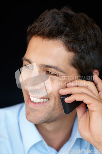 Image of Her phone calls are the best company. Shot of a handsome young professional talking on his cellphone.
