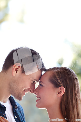 Image of Theyre ready for forever. A young couple sharing an intimate moment outdoors.