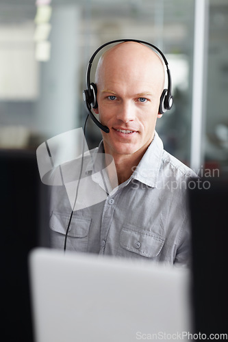 Image of Call center, man and consultant portrait in office communication, tech support and computer software. Face of IT agent, web advisor or person for information technology, helping and customer services