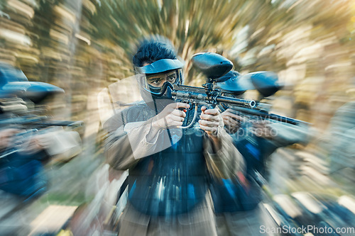 Image of Paintball, action and team of friends ready for a battle and teamwork, collaboration and shooting game together. Serious, blur and army on a mission on the battlefield with guns for competition