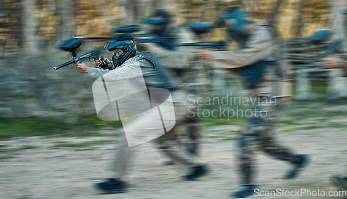 Image of Paintball, shooting and teamwork with people in playground for battlefield, mission and soldier. Sports, games and fast with motion blur men and gun in arena for challenge, adventure and warrior