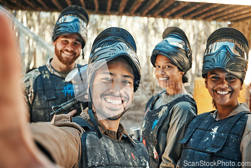 Image of Paintball team, happy selfie and group together, smile and happiness for action game, army mission and memory photo. Battlefield arena, war soldier and military post training picture to social media