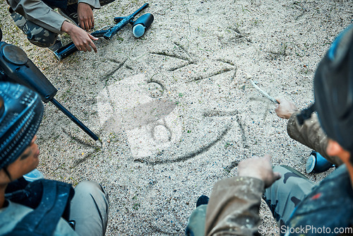 Image of Paintball, battlefield and team with planning, mission and strategy drawing in sand with soldier group. War, gun and attack game plan with people outdoor, military tactics and army hero with teamwork