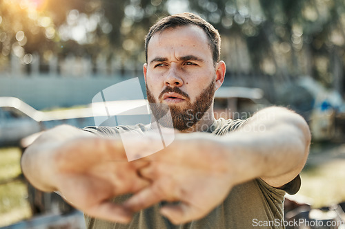 Image of Focus, stretching and a man in nature for fitness, running idea and thinking of motivation for a workout. Serious, hands and an athlete with a vision for training, exercise or a warm up in a park