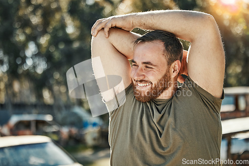 Image of Smile, thinking and a man stretching for fitness, running or an outdoor workout in nature. Happy, idea and a young athlete ready to start exercise or training for a marathon with a warm up at a park