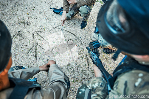 Image of Paintball, battlefield and team building with game plan, mission and strategy drawing in sand with soldier group. War, gun and plan attack, people outdoor and military tactics and army with teamwork