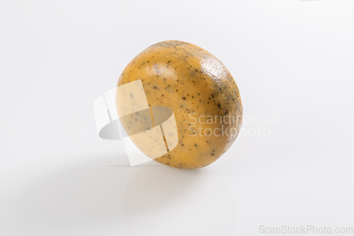 Image of A piece of fresh processed cheese isolated on a white background