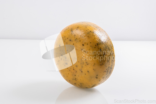 Image of A piece of fresh processed cheese isolated on a white background