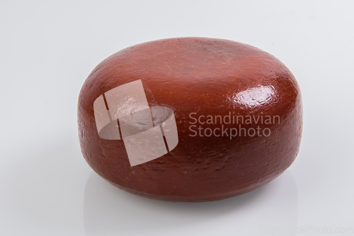 Image of A piece of fresh processed cheese isolated on a white background