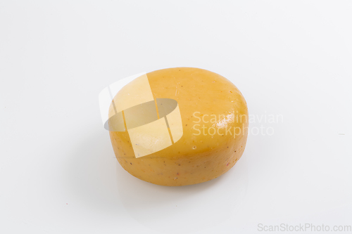 Image of A piece of fresh processed cheese isolated on a white background