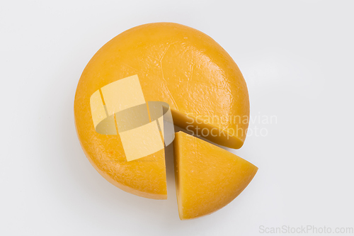 Image of A piece of fresh processed cheese isolated on a white background