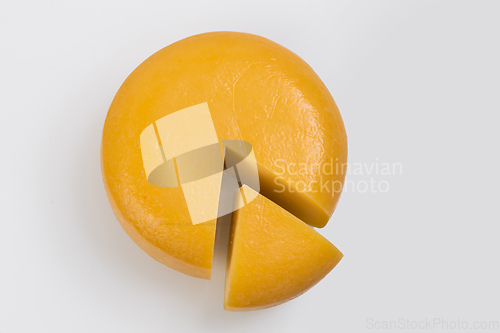 Image of A piece of fresh processed cheese isolated on a white background