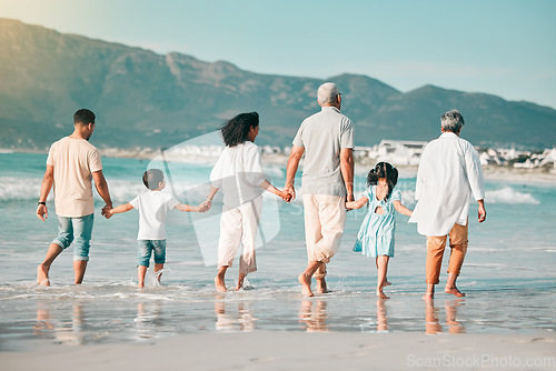 Image of Grandparents, parents or children holding hands at beach as a big family for holiday vacation travel together. Grandfather, grandmother or back of mom walking with dad, love or kids at sea to relax