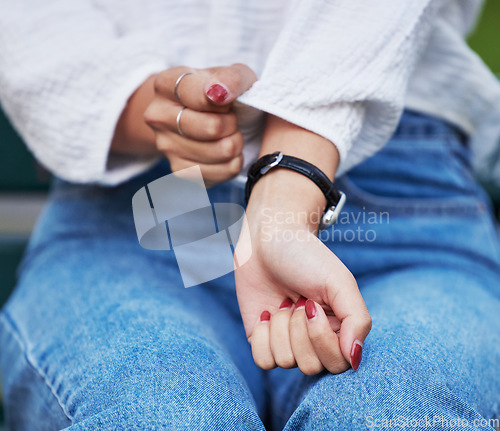 Image of Watch, sleeve and hands of woman with stress in a outdoor park with anxiety and jewelry fashion in outdoor nature. Manicure, ring and person with a stress, worry and an accessory nail polish