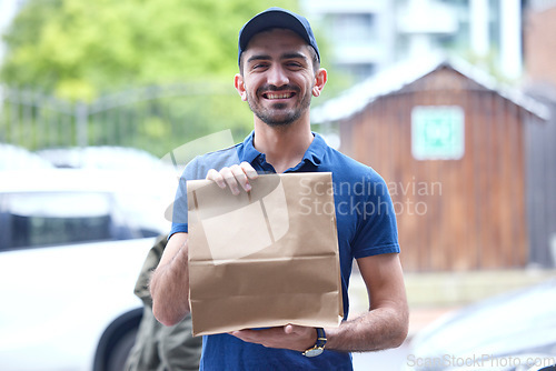 Image of Happy man, portrait and paper bag for delivery, supply chain or transport of goods in courier service. Friendly male person with parcel, package or cargo for online order, purchase or ecommerce