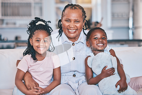 Image of Black children, portrait and senior grandmother on sofa with quality time with love in family home. Kid, together and happy face on couch with elderly female with care in lounge with smile.