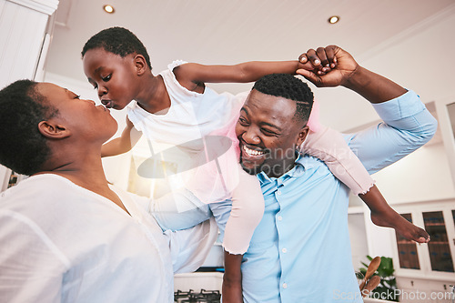 Image of Family, kiss or piggyback and a girl in the home with her parents for fun or bonding together. Mothers day, love or smile with african parents and their daughter looking playful in their house