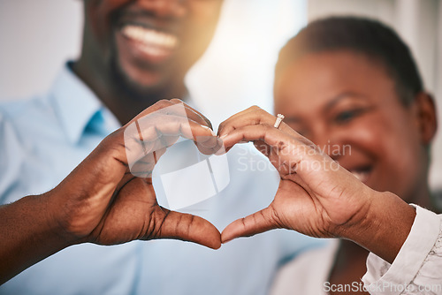 Image of Hands in heart, love and couple with sign by home with gesture for love, support and care. Emoji, happy and closeup of black man and woman with shape for bonding, commitment and healthy marriage