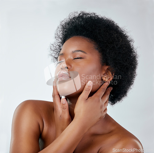 Image of Afro, beauty and skincare with black woman or cosmetics in studio background for glow. Natural, face and hand with african girl for haircare or treatment, shine for self love or wellness in mock up.