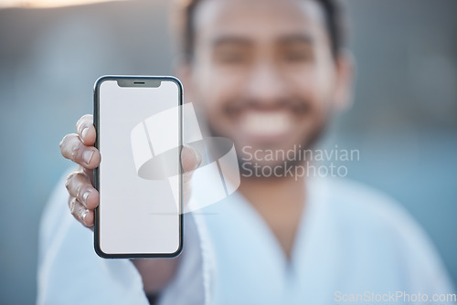 Image of Sports, fitness mockup or happy man with phone for karate tips, fighting info or martial arts promo code. Portrait blur, screen or mma fighter with mobile app in healthy workout, exercise or training