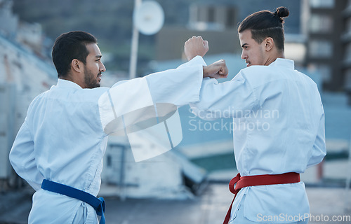 Image of Men, fight and punch in karate class, training and speed with sparring partner, workout and morning for development. Martial arts team, contest and fitness with mma exercise, coaching or sports