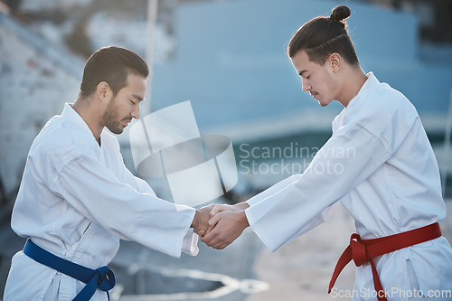 Image of Men, karate and shaking hands at training fight with respect, fitness and start workout contest for development. Martial arts coaching, together or peace for exercise, zen mindset or combat sports