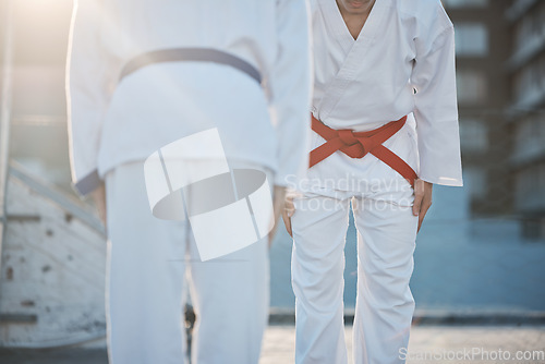 Image of Karate, bow and men outdoor for training, workout and start exercise in city. Martial arts, sports and people in competition for taekwondo, battle and challenge to fight for healthy body in fitness