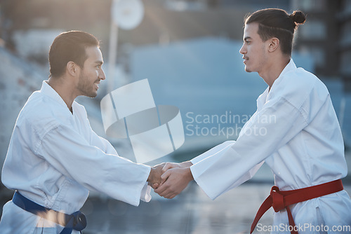 Image of Men, karate and handshake at training fight for respect, fitness or workout contest for development. Martial arts teacher, coaching and smile for exercise, zen mindset or outdoor for combat sports