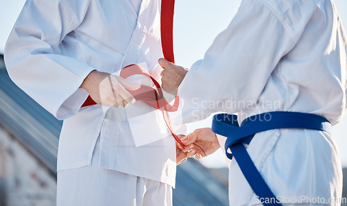 Image of Karate, belt and people outdoor for training, workout or fitness achievement in city. Martial arts, sports and coach with student for taekwondo competition, battle and challenge to fight or exercise